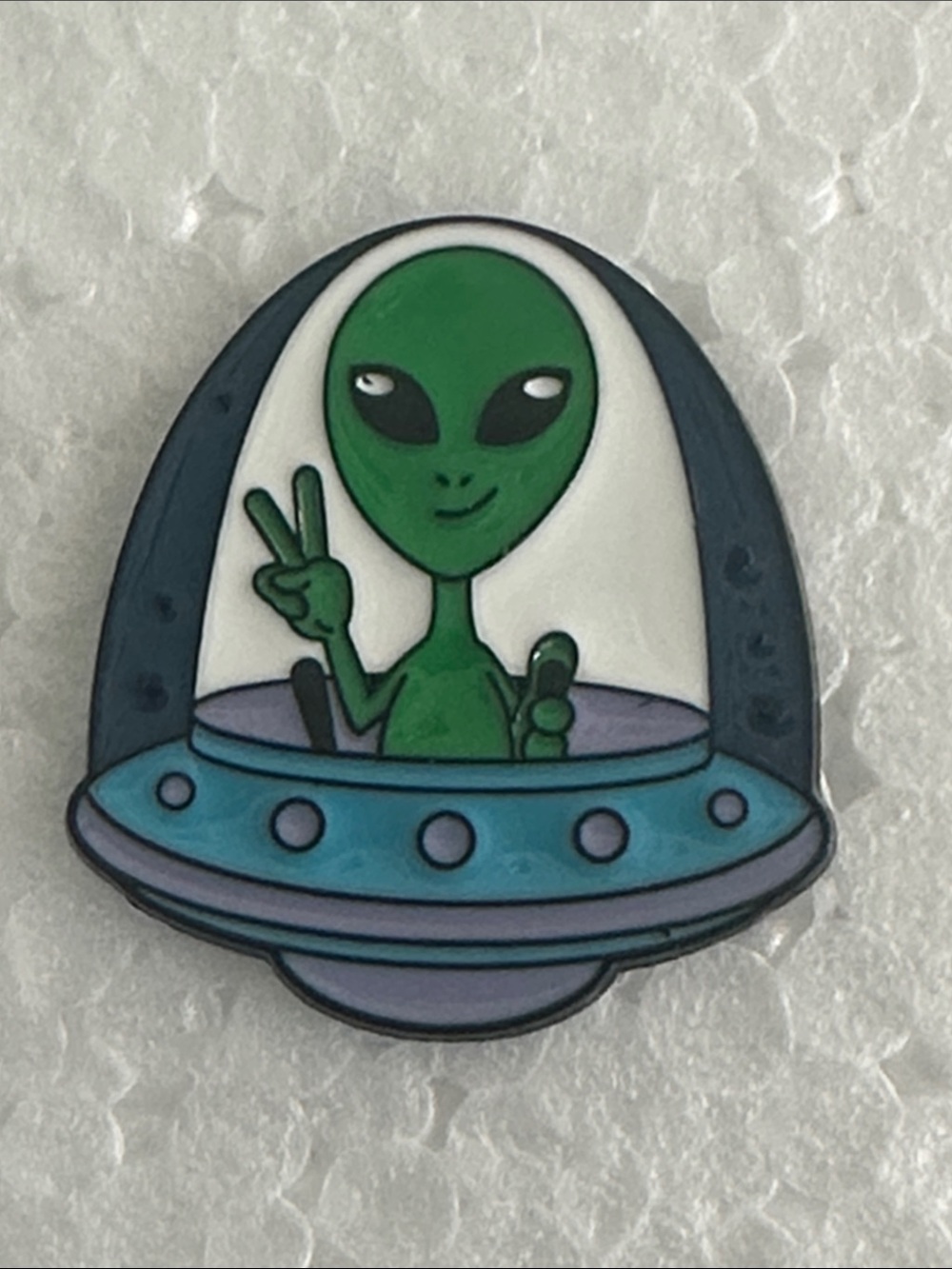 Green Alien in Blue UFO Enamel Pin